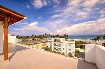 a balcony with a view of the beach at Sunset Calm Penthouse in Cabarete