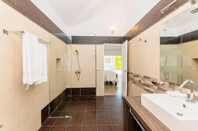 a bathroom with a sink and a shower at Villa Ocean Dream 3BR Oasis and guesthouse in Sosúa