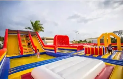 a brightly colored playground with a slide and chairs at Villa Ocean Dream 3BR Oasis and guesthouse in Sosúa