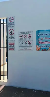 a sign on a wall with signs on it at Oasis in Graditti valley in Santiago de los Caballeros