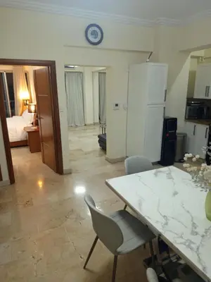a kitchen and living room with a table and chairs at Torre chalom in Santo Domingo