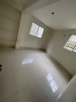 an empty room with two windows and a white floor at Bohio rd in Santo Domingo