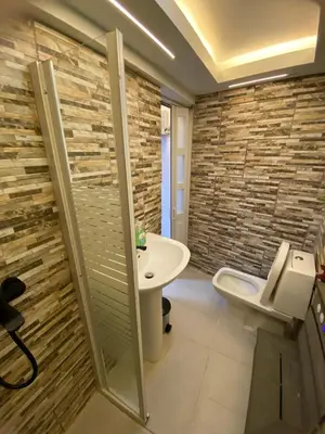 a bathroom with a toilet and a sink at Luxury Beautiful mini apartment Private jacuzzi in Santo Domingo