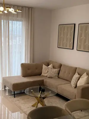 a living room with a couch and a glass table at Apartamento en livera RD in Santiago de los Caballeros
