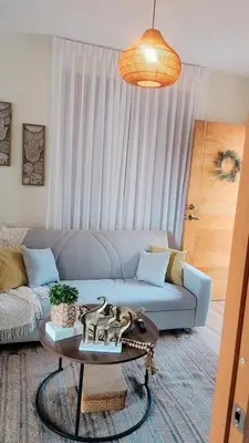 a living room with a couch and a table at El descanso in Higuey