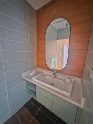 a bathroom with a sink and a mirror at Oceanfront villa with pool, Ocoa bay in Azua