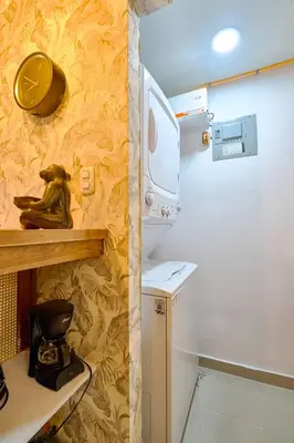 a small kitchen with a stove and a microwave at ®{The-Comfty-Spot} Experience @SD WiFi in Santo Domingo