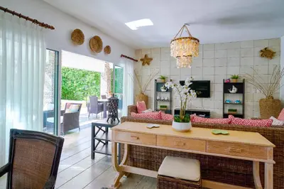 a living room with a couch and a table at ®2BR{Beach~Spot} @TerrenasJaccuziWalk~to~Beach in El Limón
