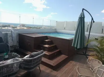 a swimming pool on the roof of a building at Sky 01 M11 in Santo Domingo