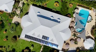 an overhead view of a white building with a swimming pool at Oris Chic & Tropical Suite, Breakfast in Las Terrenas