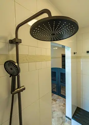 a shower with a shower head in a bathroom at Oris Chic & Tropical Suite, Breakfast in Las Terrenas