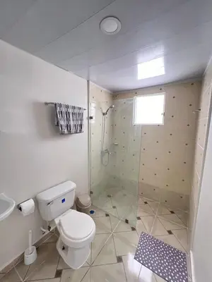a bathroom with a toilet and a shower at Apartamento en bani in Baní