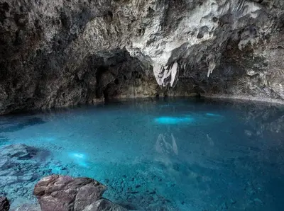a blue pool of water in a cave at Civil tower oceance in Santo Domingo