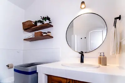 a bathroom with a sink and a mirror at Cultrera 1 in Las Terrenas