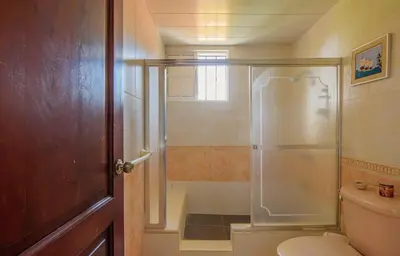 a bathroom with a shower and a toilet at Villa Cancanet in Nizao