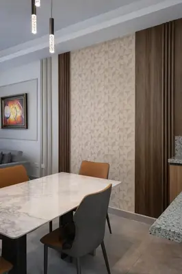 a dining room with a white table and chairs at Modern Luxury Apt Pool, Gym and Prime Location in La Julia