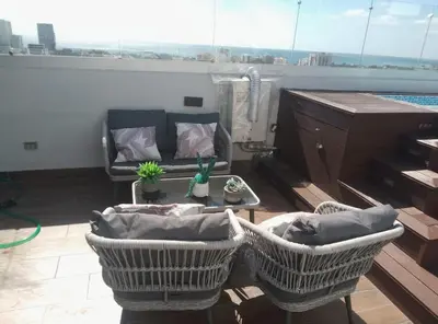 a living room with a couch and a table at Sky 01 M10 in Santo Domingo