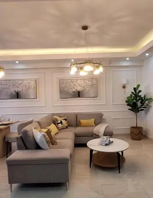 a living room with a couch and a table at Exclusive apartment in SDE in Juan López