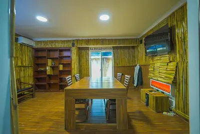 a dining room with a large wooden table and chairs at Luxury Caribbean penthouse in Santo Domingo