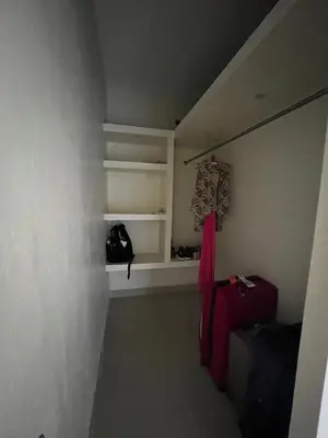 a room with a staircase with a red suitcase at Pequeña villa de María in Villa Mella