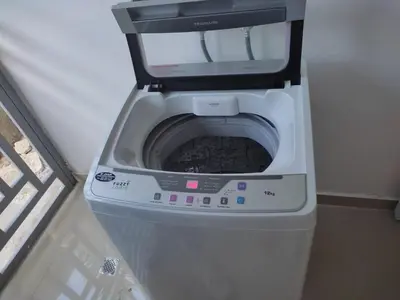 a washer and dryer sitting in a room at Residencial Naime 3 Bristol in San Pedro de Macorís