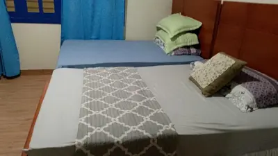 a bed with two pillows on top of it at Alto Nuevo