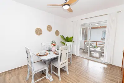 a dining room with a table and chairs at Caribbean Escape 1BR at Paraiso Bayahibe in Bayahibe
