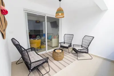 a group of chairs and a table in a room at Caribbean Getaway 2BR at Caribbean Rose Bayahibe in San Rafael del Yuma