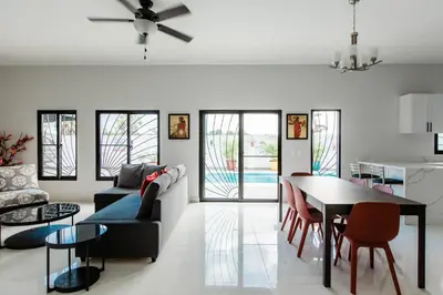 a living room with a couch and a table at SwellHouseVilla in Cabrera
