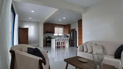 a living room with a couch and a table at Cigua Palmera 42 in Puerto Plata