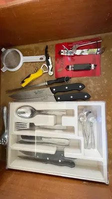 a drawer with a bunch of kitchen utensils in it at Hideaway Studio - steps from Playa Encuentro at Cabarete in Cabarete