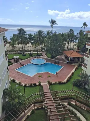 an aerial view of a resort with a swimming pool at Apartment facing the Caribbean Sea, Juan Dolio Beach in Juan Dolio
