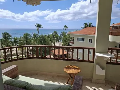 a balcony with a view of the ocean at Apartment facing the Caribbean Sea, Juan Dolio Beach in Juan Dolio