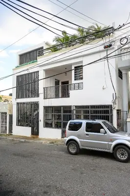 a silver suv parked in front of a white building at Spacious Family Home with Sea & Mountain Views in Puerto Plata in San Felipe de Puerto Plata