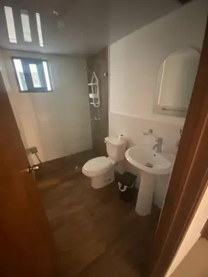 a bathroom with a toilet and a sink at Apartmento en Caleta, La Romana in La Romana