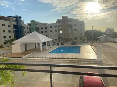 a swimming pool on the roof of a building at Apartmento en Caleta, La Romana in La Romana