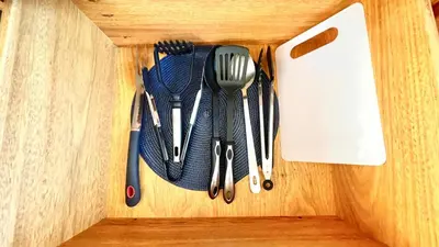 a wooden drawer with utensils in a wooden cabinet at 2BR villa & 1BR Guest House, Pool and Beach at Playa Encuentro, Cabarete in Cabarete