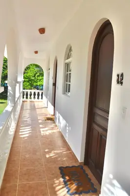 a hallway of a house with a door at Beachfront Hideaway 2BR Apartment at Playa Encuentro, Cabarete in Cabarete