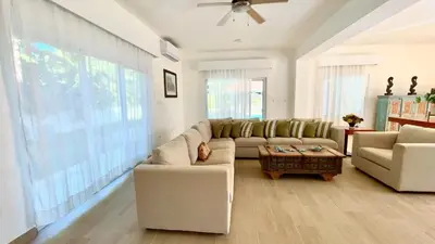 a living room with a couch and a table at 3BR Hideaway Lux Villa With Pool & beach Access At Playa Encuentro, Cabarete in Cabarete