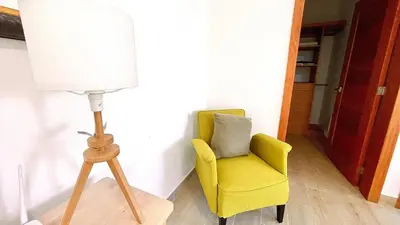 a lamp and a yellow chair in a room at 3BR Hideaway Lux Villa With Pool & beach Access At Playa Encuentro, Cabarete in Cabarete