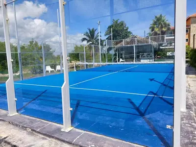 a tennis court with a net on it at Apartamento Luxury Punta Cana in Punta Cana
