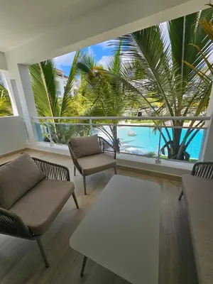 a living room with a view of the ocean at Estrella Garden Antlia 201 Modern Apartment in La Laguna