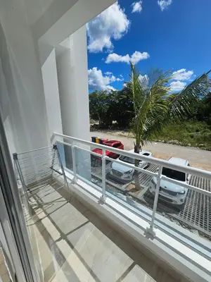 a balcony with a view of a car parked on a street at Estrella Garden Antlia 201 Modern Apartment in La Laguna