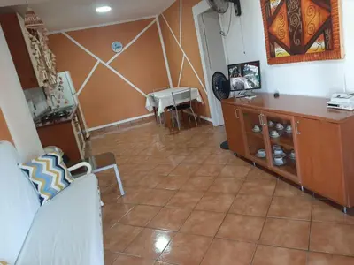 a living room with a couch and a table at Palm Beach Resort in Boca Chica
