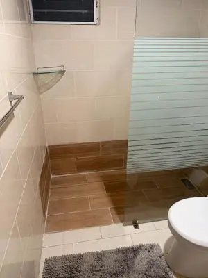 a bathroom with a shower with a toilet and a sink at Filadelfia II in La Grúa