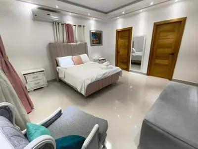 a bedroom with a bed and a couch at América Colares VII in Los Frailes