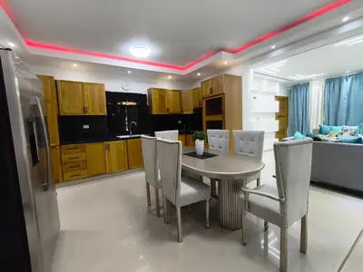a kitchen with a dining room table and chairs at América Colares VII in Los Frailes