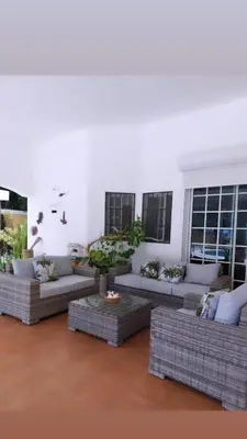 a living room with couches and tables and windows at Villa can canet in Nizao