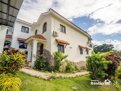 a house in the middle of a yard at Casa Estrella, Where Relaxation Begins in Sosúa