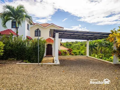 a pergola in front of a house at Casa Estrella, Where Relaxation Begins in Sosúa
